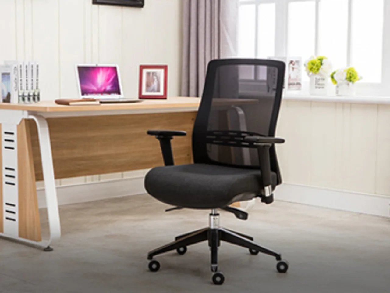 Shengxin black mesh-back office task chair with adjustable arms in a home office